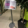 Free standing twin pane Satellite sign holder in use at gatwick Airport